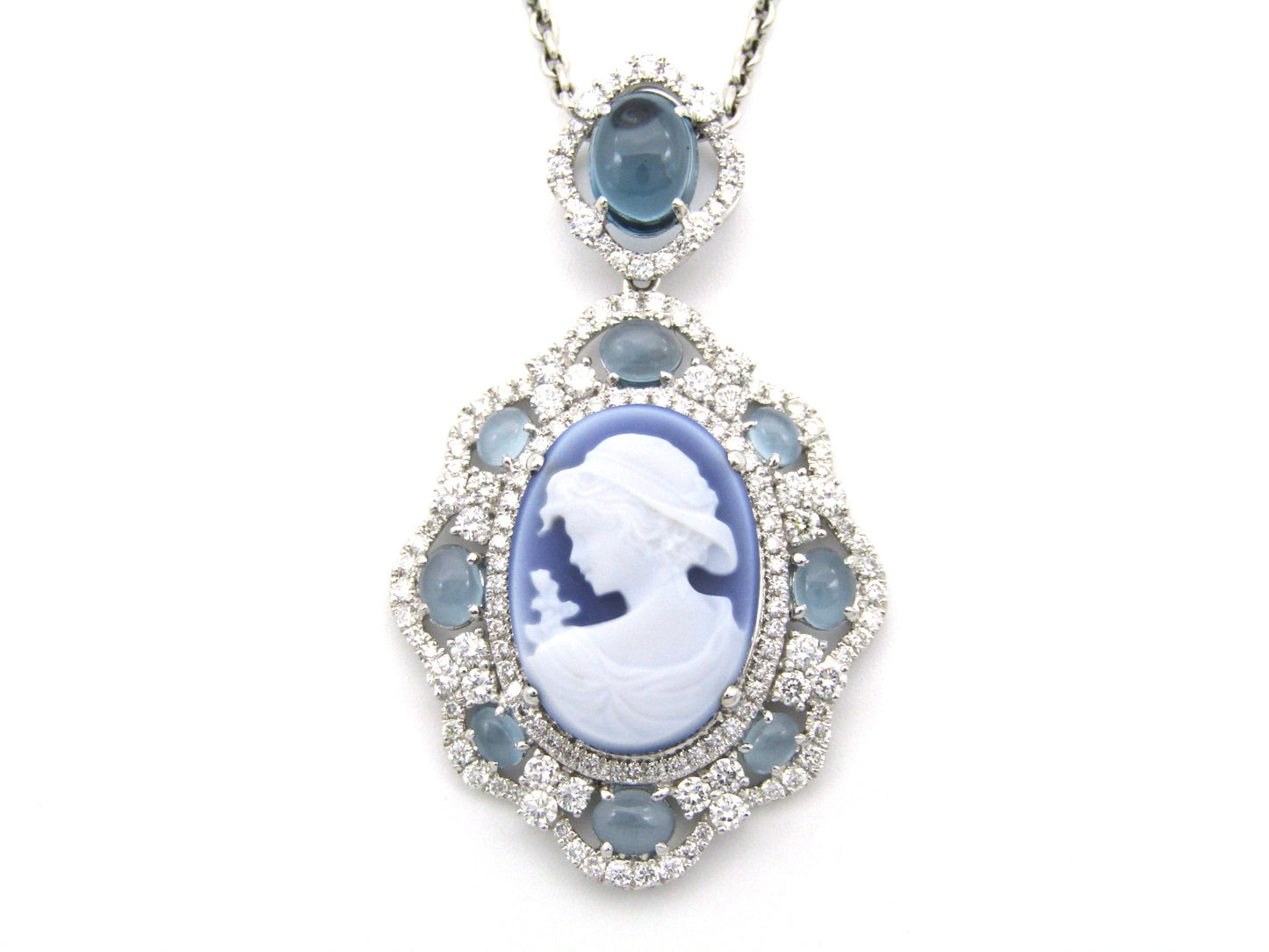 18K gold agate cameo, blue topaz and diamond pendant.