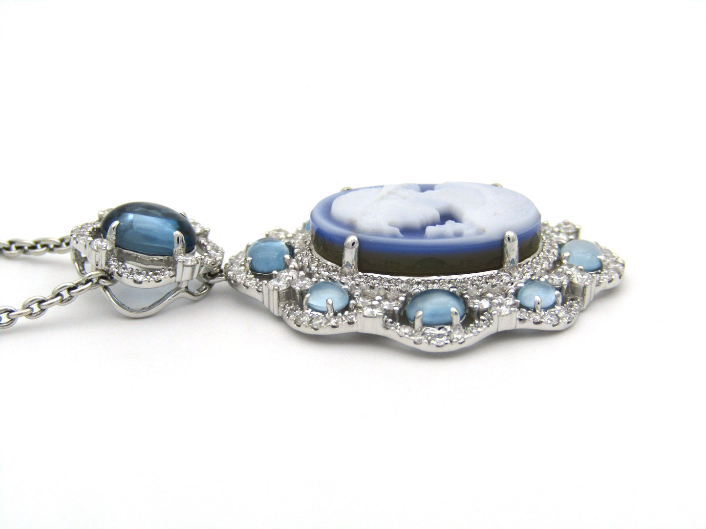18K gold agate cameo, blue topaz and diamond pendant.