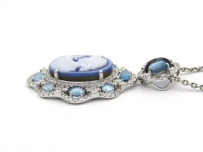 18K gold agate cameo, blue topaz and diamond pendant.