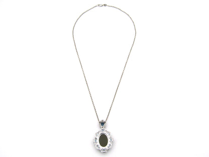 18K gold agate cameo, blue topaz and diamond pendant.