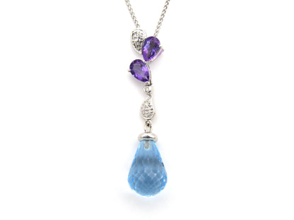 18K gold blue topaz, amethyst, and diamond pendant.