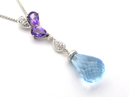 18K gold blue topaz, amethyst, and diamond pendant.