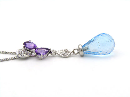 18K gold blue topaz, amethyst, and diamond pendant.