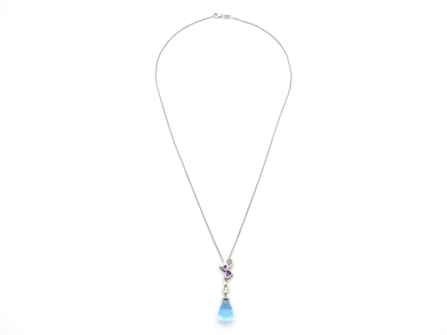 18K gold blue topaz, amethyst, and diamond pendant.