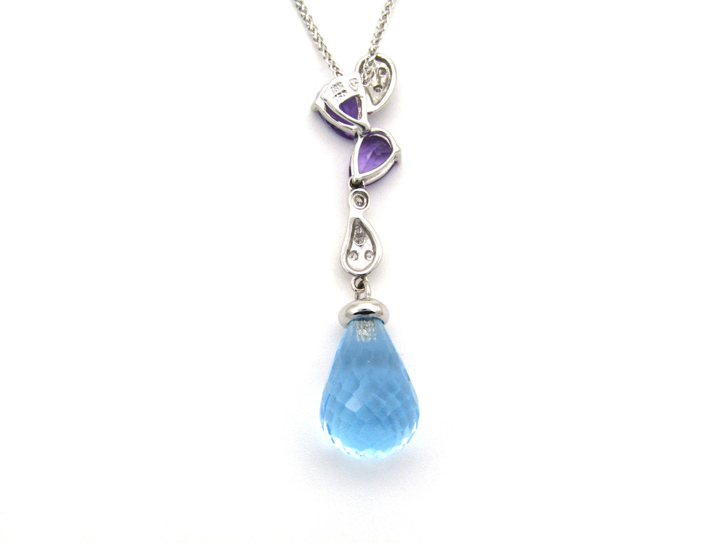 18K gold blue topaz, amethyst, and diamond pendant.