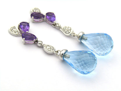 18K gold blue topaz, amethyst, and diamond earrings.