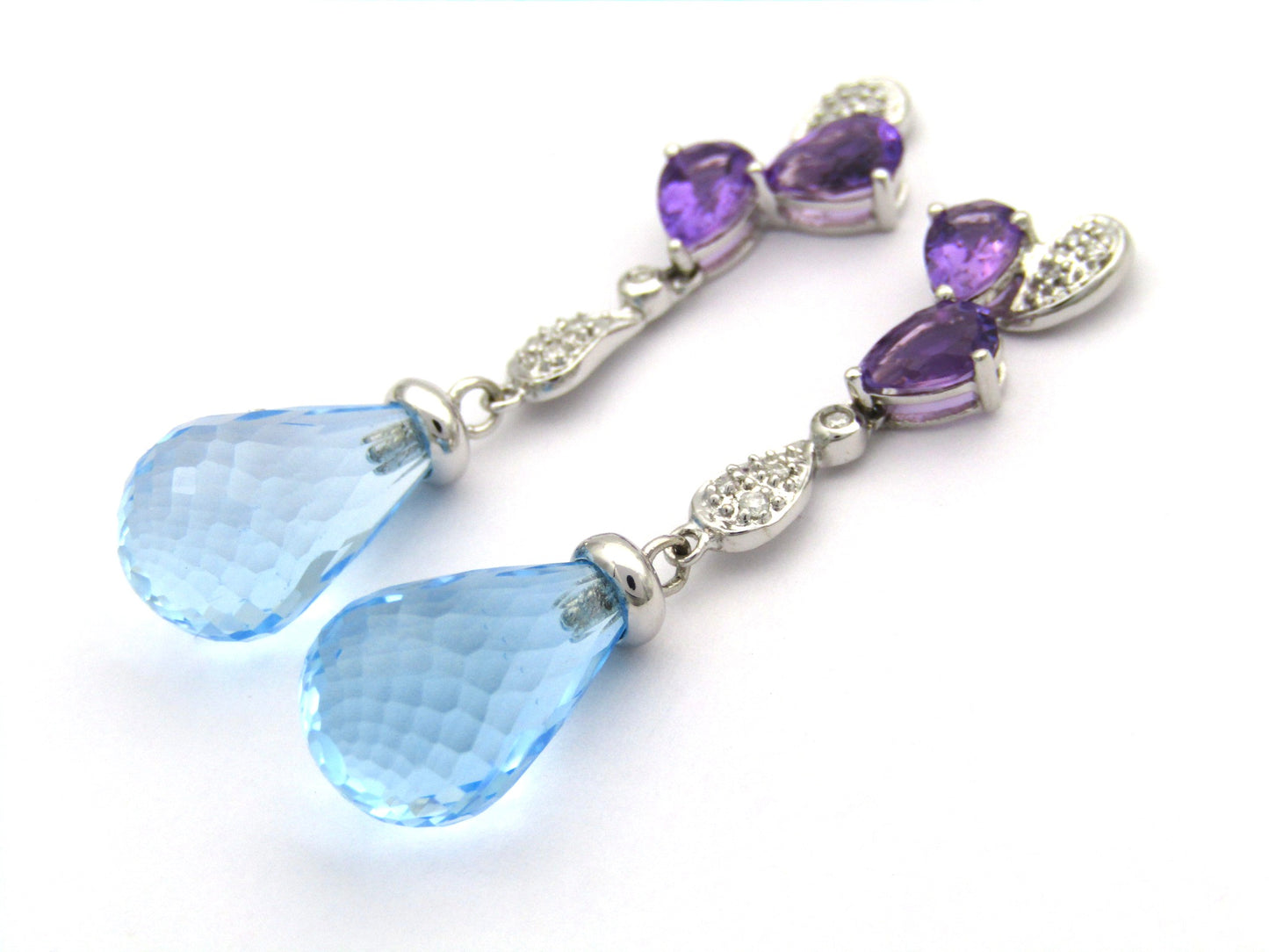 18K gold blue topaz, amethyst, and diamond earrings.