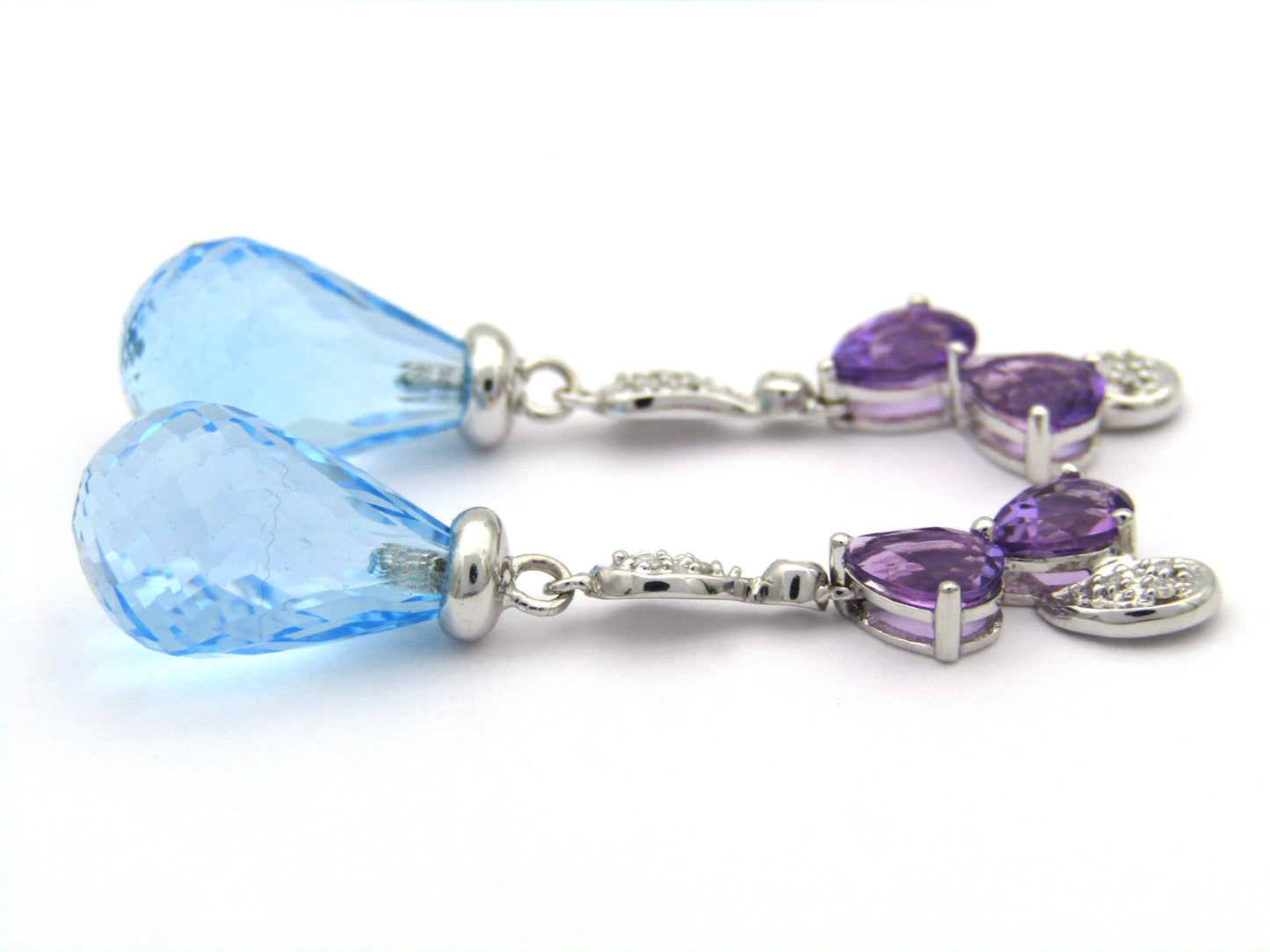 18K gold blue topaz, amethyst, and diamond earrings.