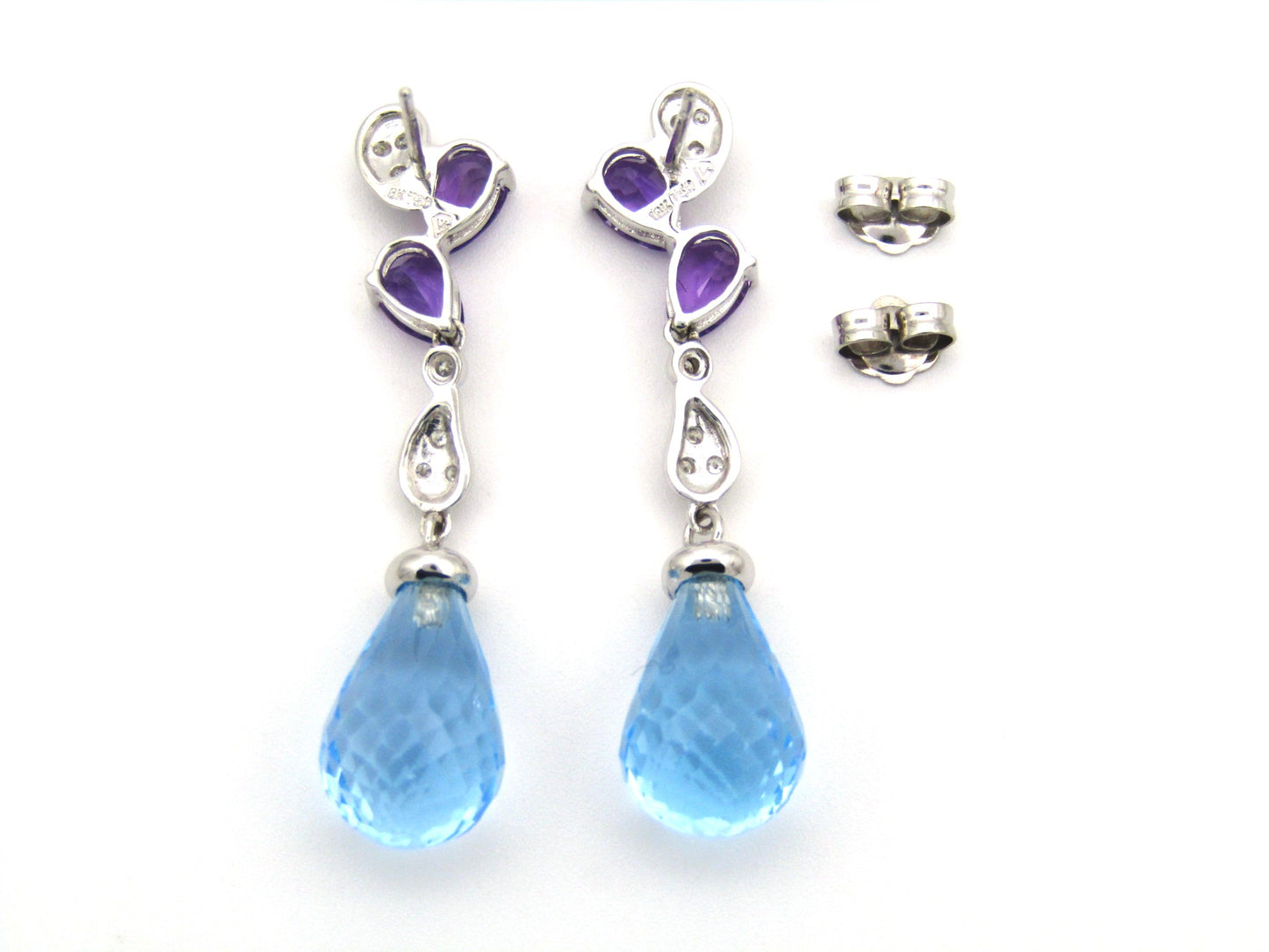 18K gold blue topaz, amethyst, and diamond earrings.