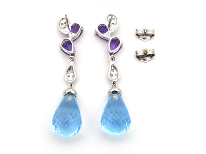 18K gold blue topaz, amethyst, and diamond earrings.