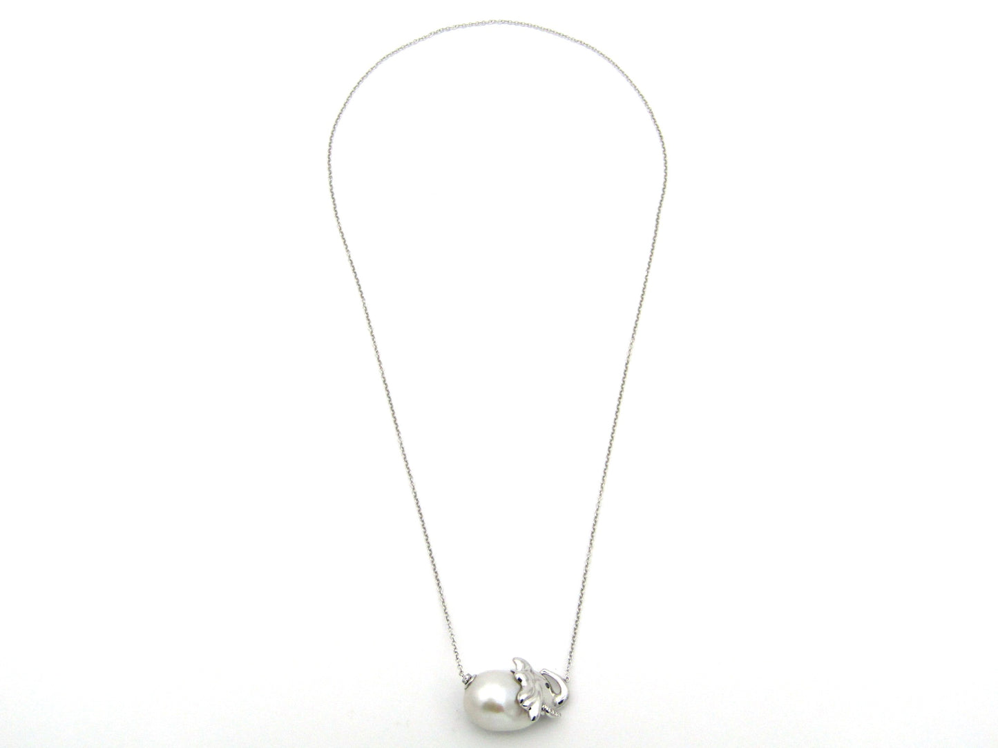 14K gold floating baroque pearl and diamond elephant necklace.