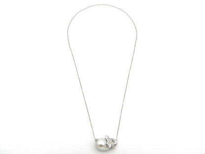 14K gold floating baroque pearl and diamond elephant necklace.