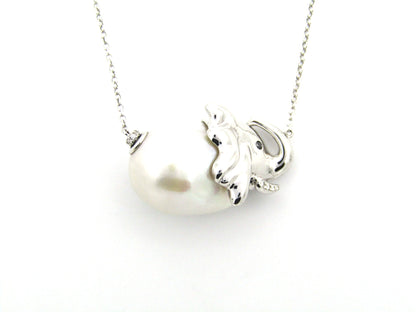 14K gold floating baroque pearl and diamond elephant necklace.