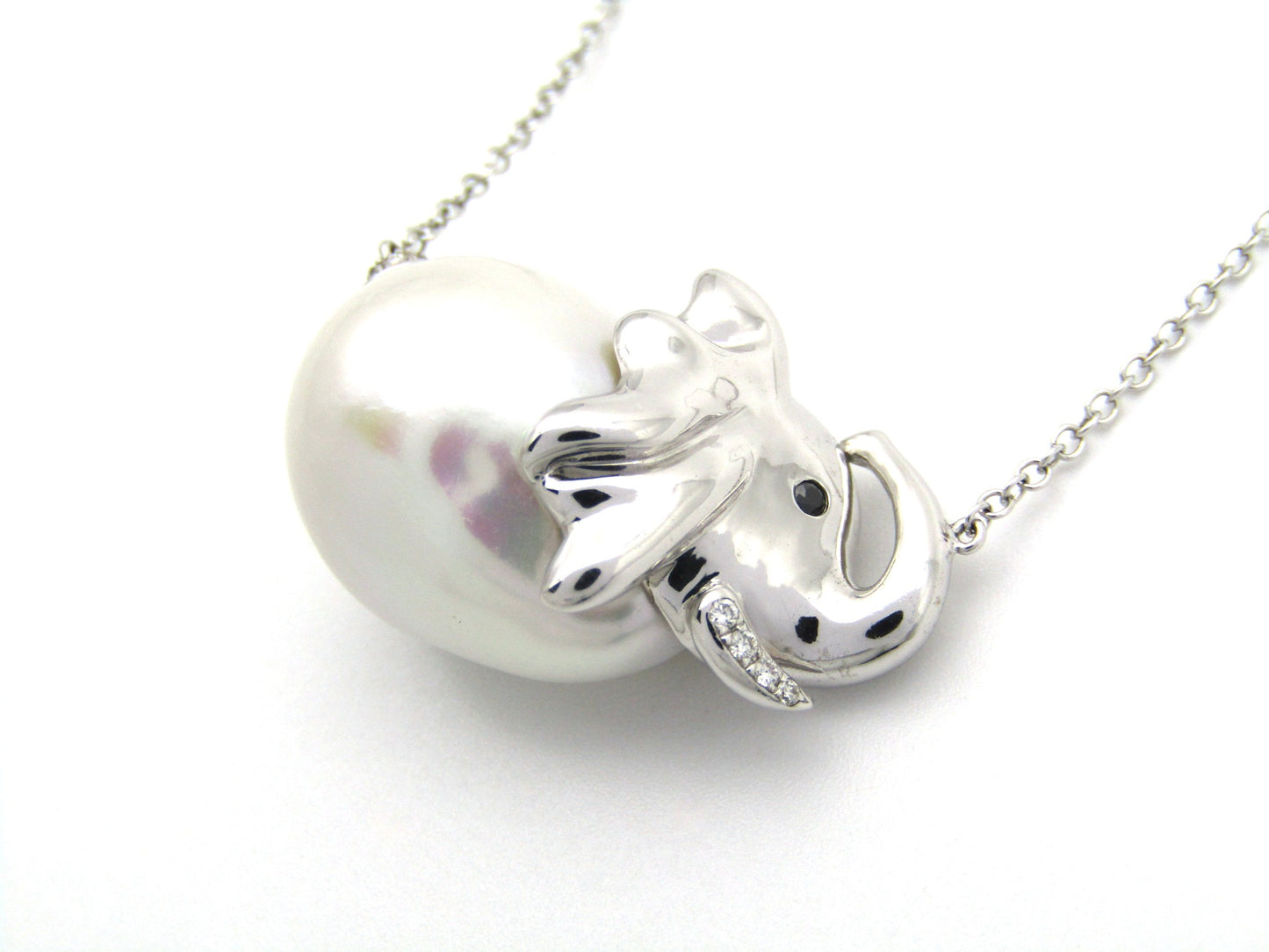 14K gold floating baroque pearl and diamond elephant necklace.