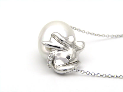 14K gold floating baroque pearl and diamond elephant necklace.