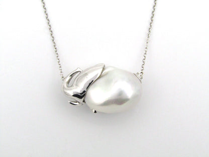 14K gold floating baroque pearl and diamond elephant necklace.