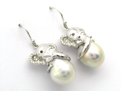 14K gold baroque pearl and diamond elephant earrings.