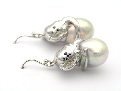 14K gold baroque pearl and diamond elephant earrings.
