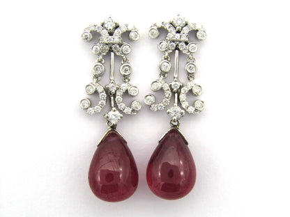 18K gold glass-filled ruby and diamond drop earrings.