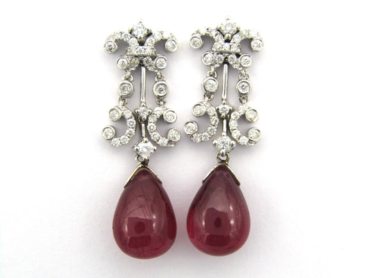 18K gold glass-filled ruby and diamond drop earrings.