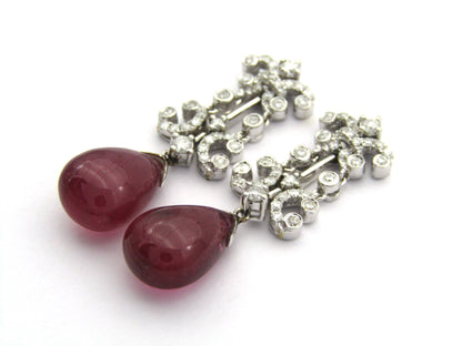 18K gold glass-filled ruby and diamond drop earrings.