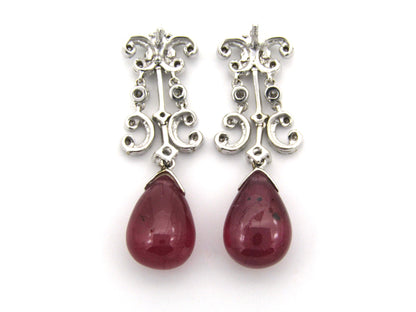 18K gold glass-filled ruby and diamond drop earrings.