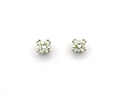 9K gold diamond studs.