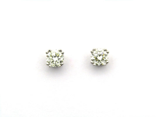 9K gold diamond studs.