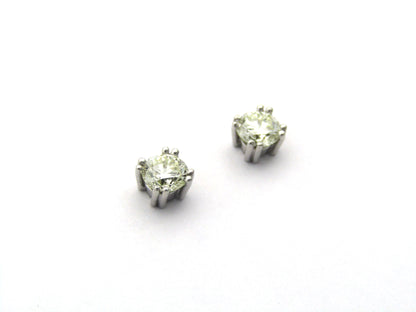 9K gold diamond studs.