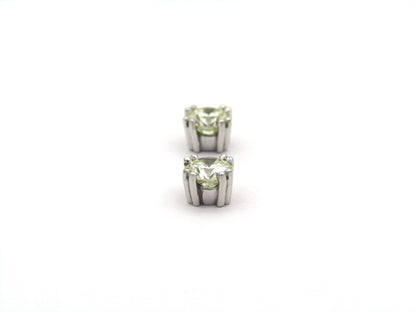 9K gold diamond studs.