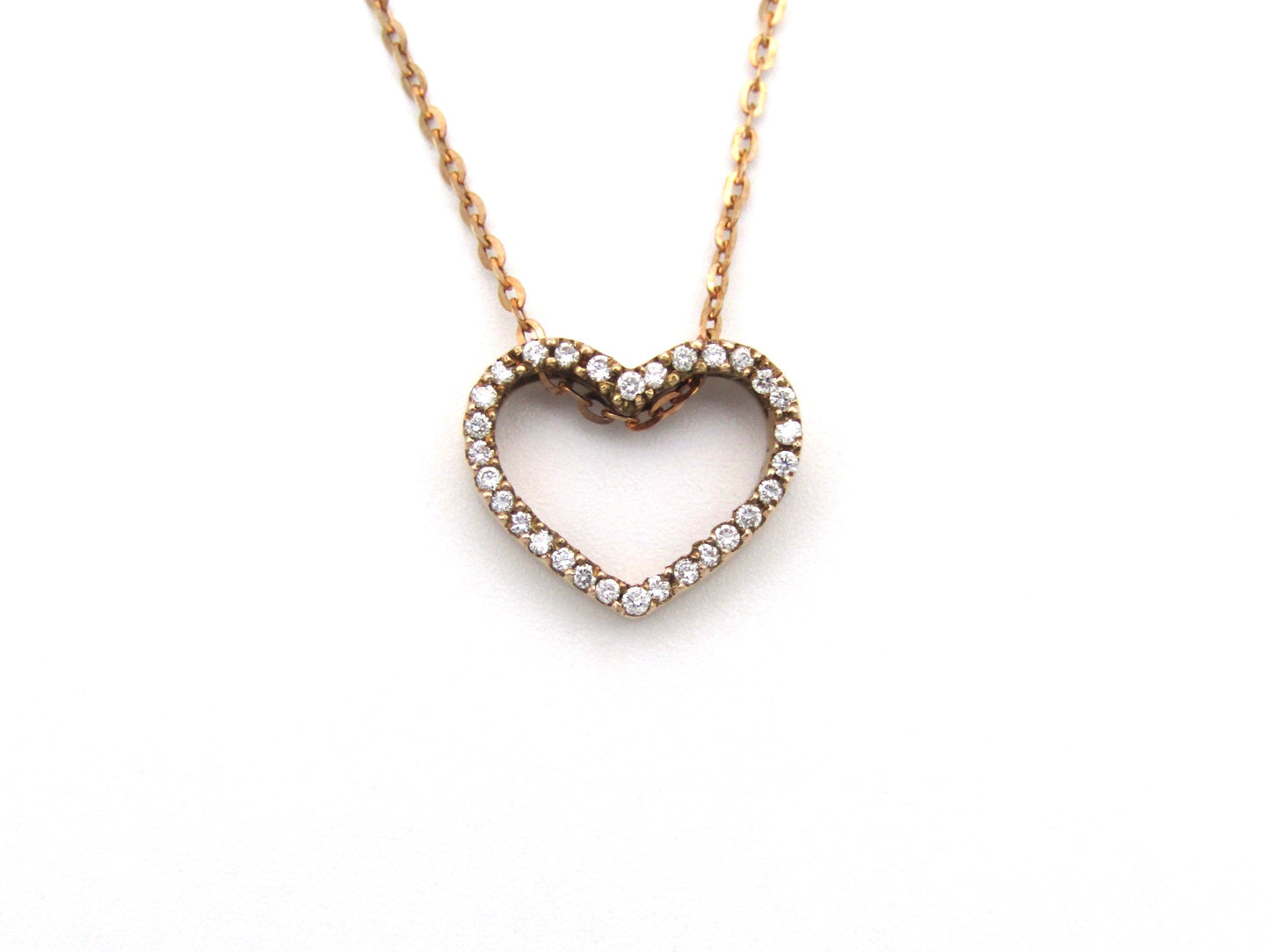 9K gold diamond heart pendant.