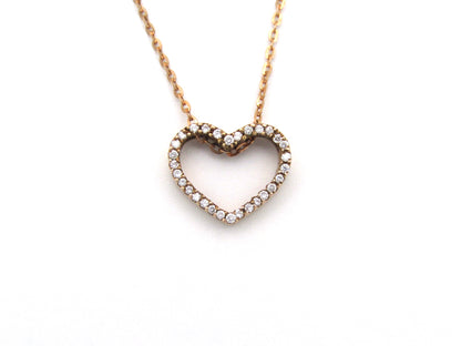 9K gold diamond heart pendant.