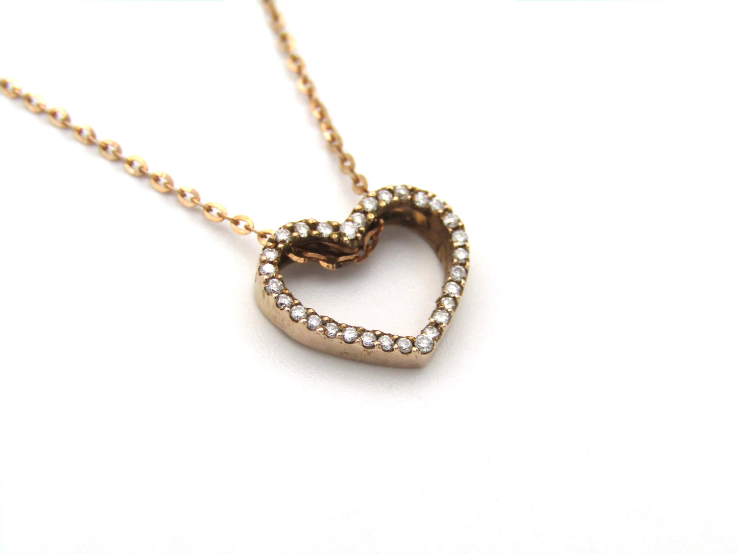 9K gold diamond heart pendant.