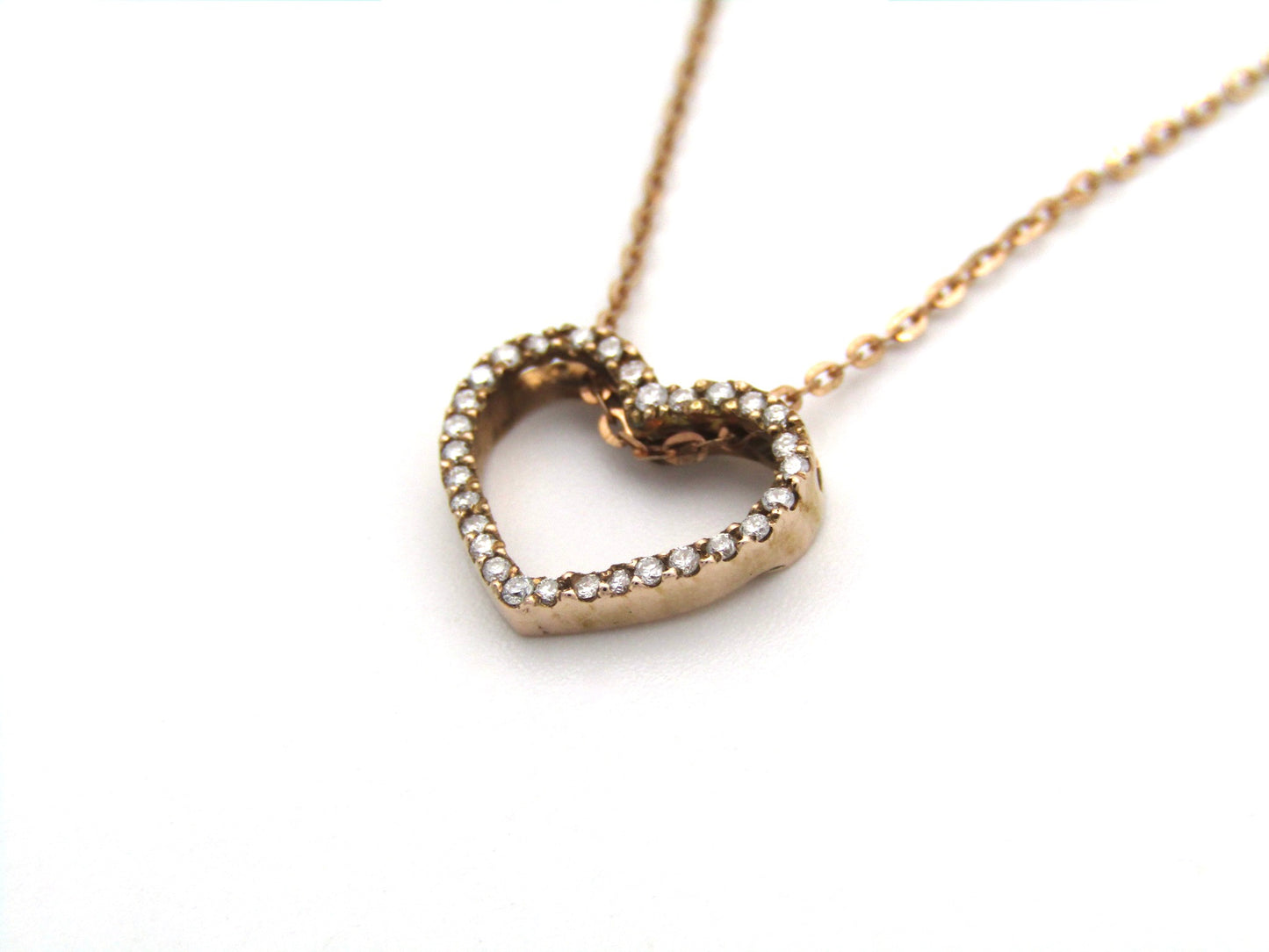 9K gold diamond heart pendant.