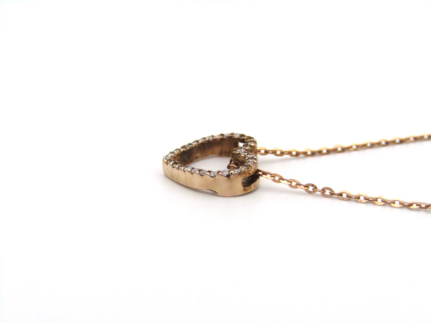 9K gold diamond heart pendant.