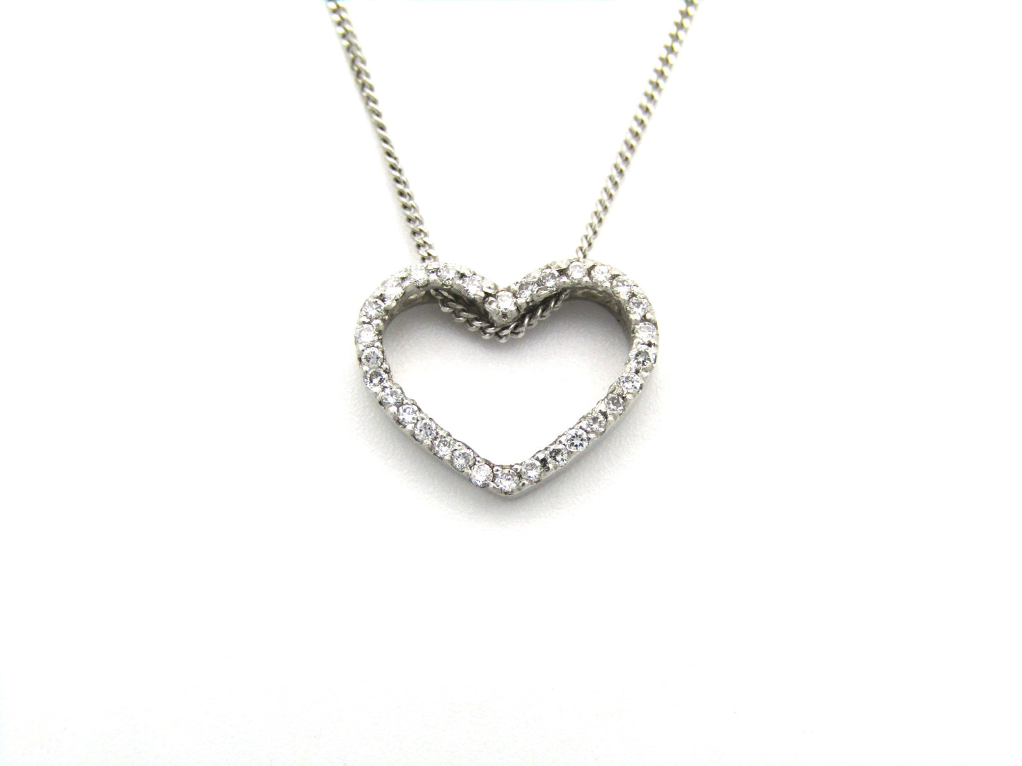 9K gold diamond heart pendant.