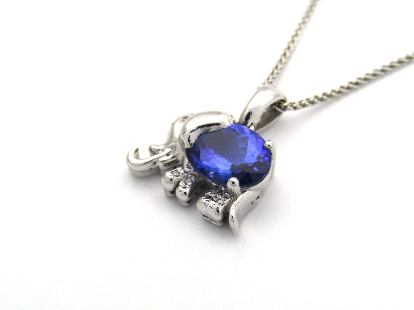 18K gold tanzanite and diamond elephant pendant.
