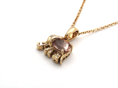 18K gold morganite and diamond elephant pendant.