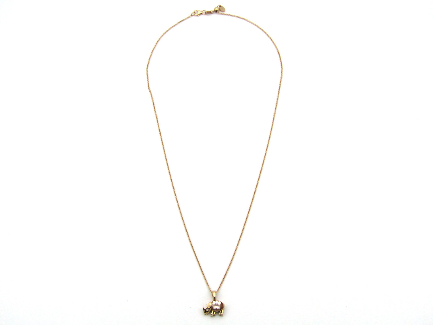 18K gold morganite and diamond rhino pendant.