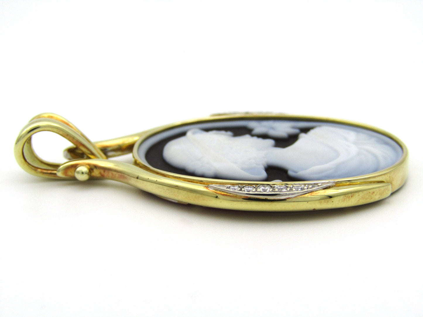 18K gold hard stone cameo and diamond pendant.