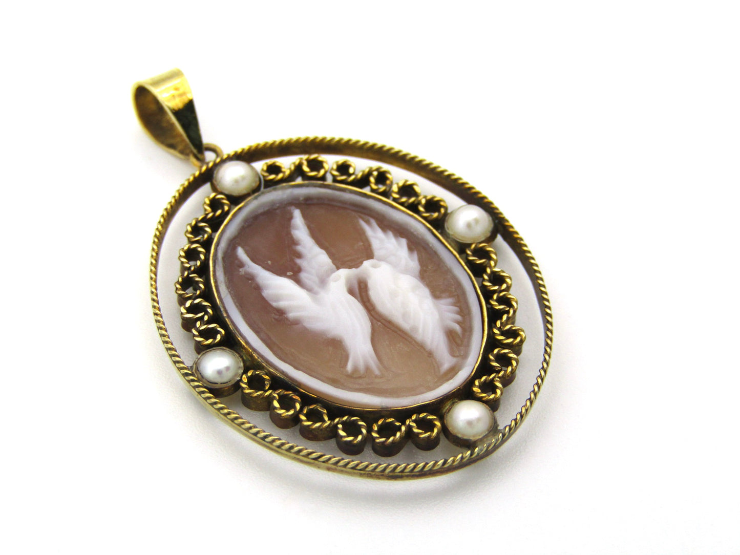 9K gold conch shell cameo and cultured akoya pearl pendant.