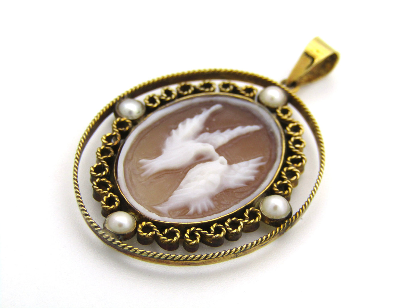 9K gold conch shell cameo and cultured akoya pearl pendant.