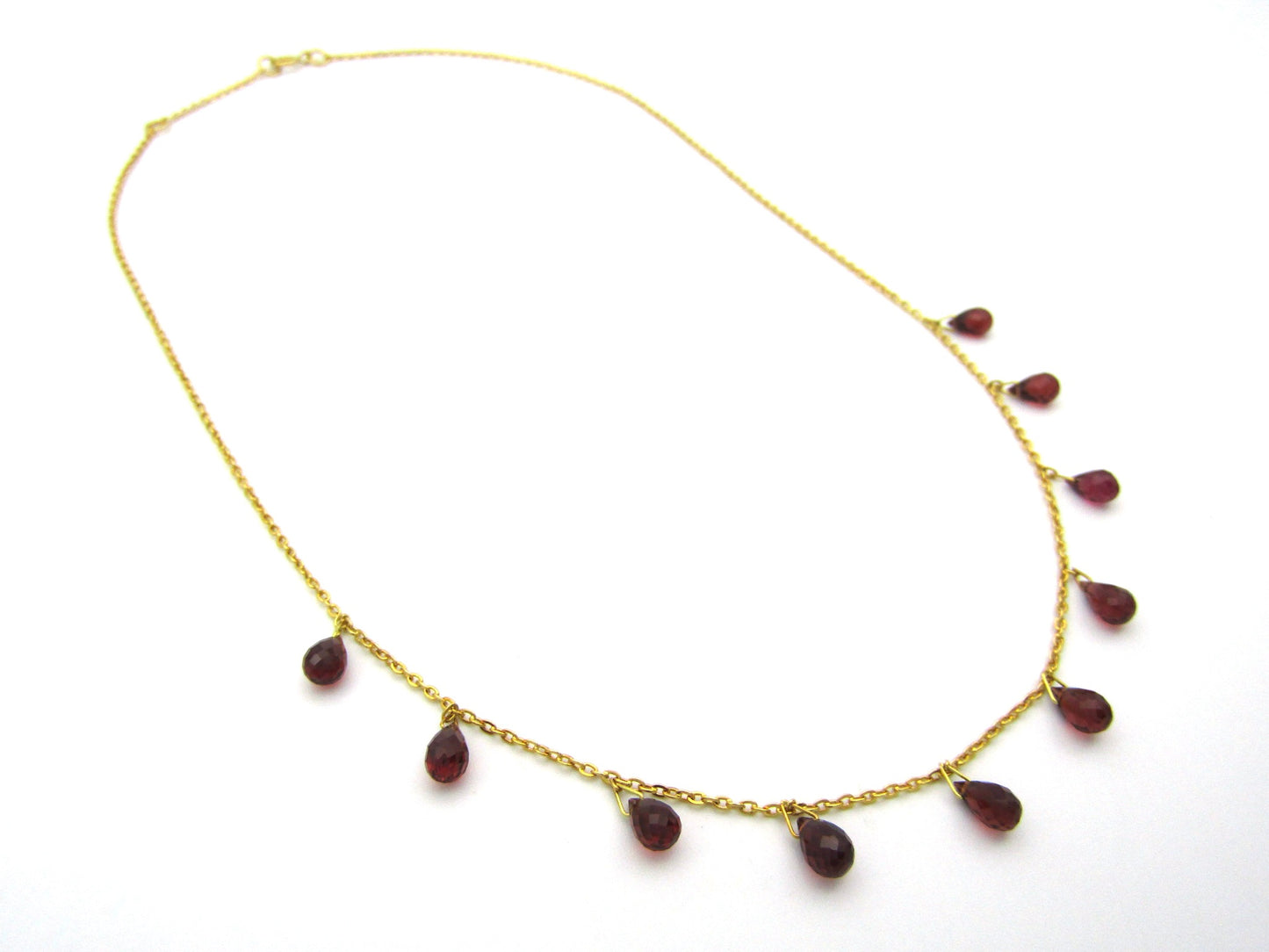 18K gold garnet necklace.