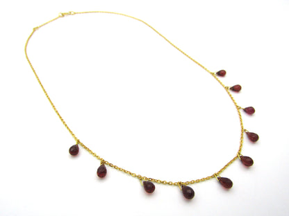 18K gold garnet necklace.