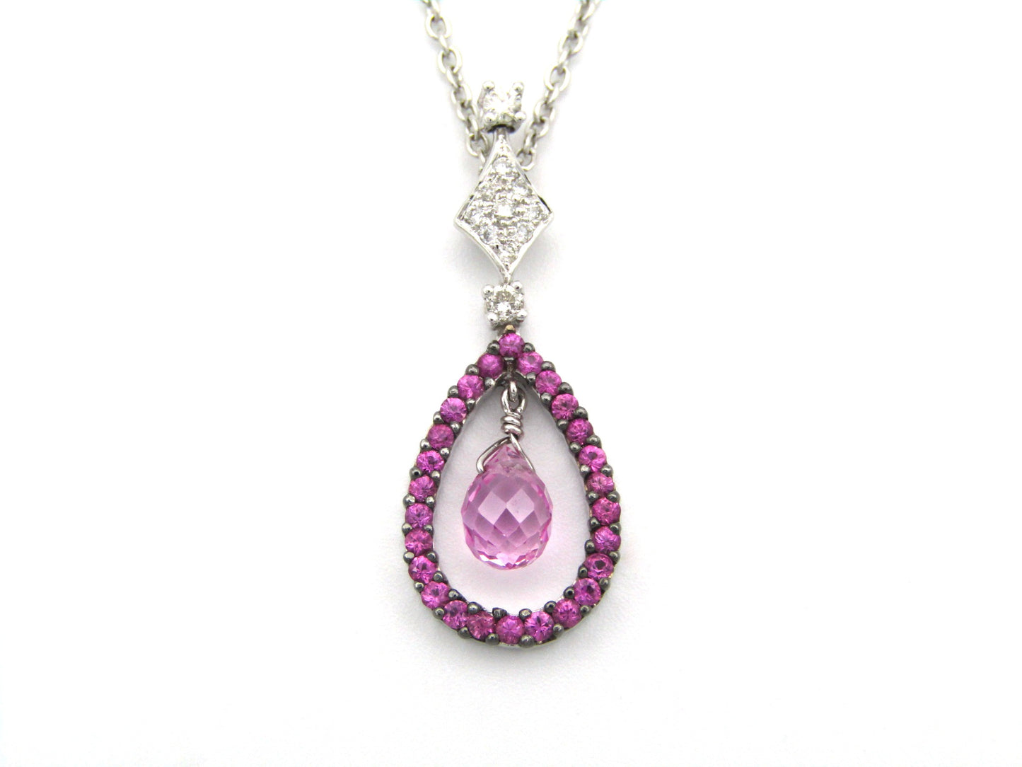 18K gold pink sapphire and diamond pendant.