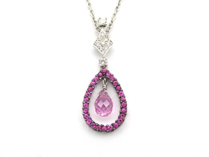 18K gold pink sapphire and diamond pendant.