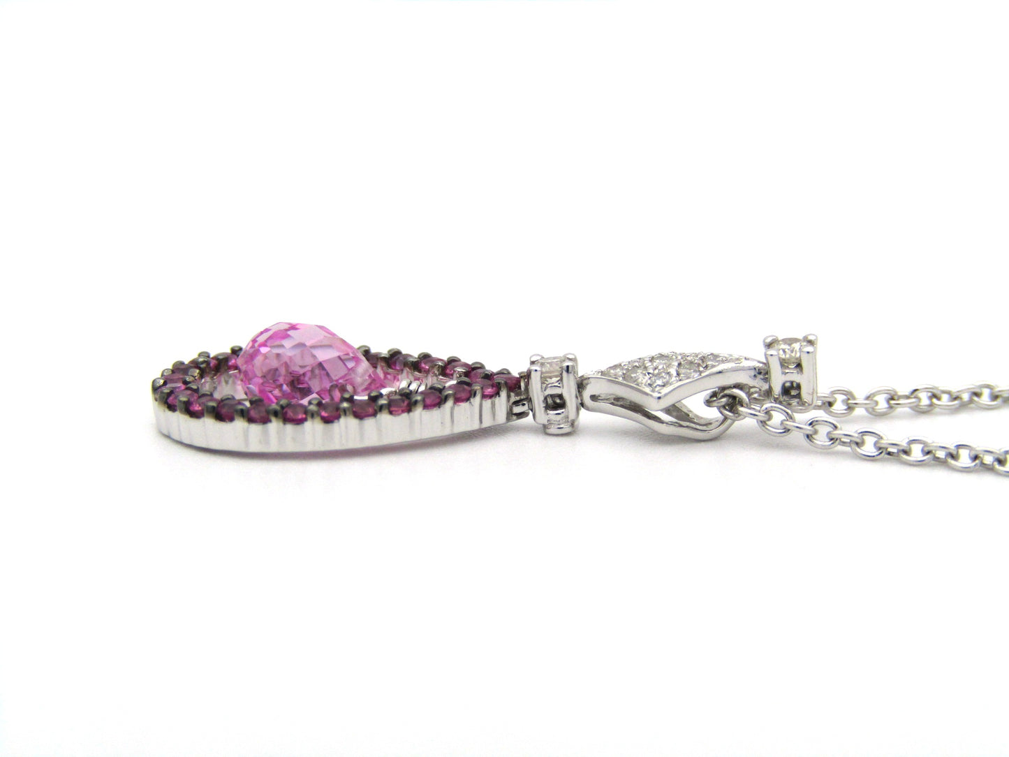 18K gold pink sapphire and diamond pendant.