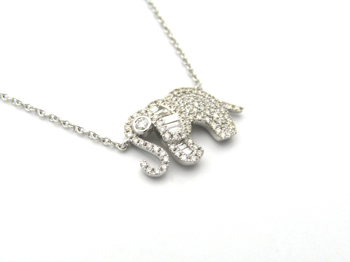 18K gold diamond elephant necklace.