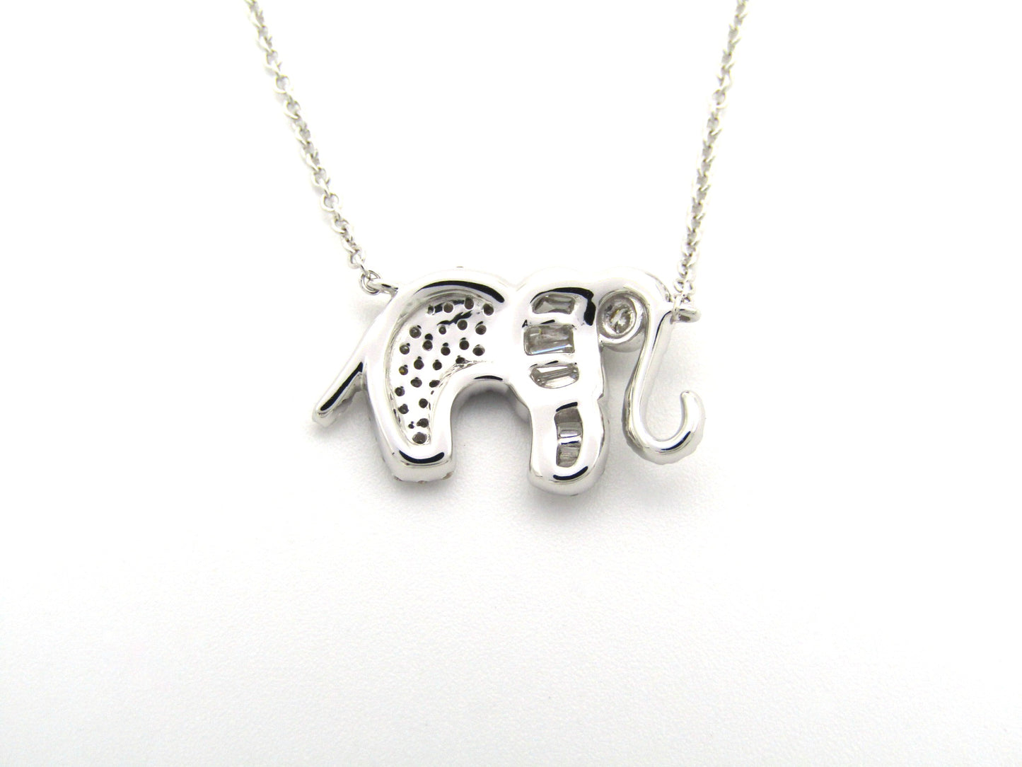 18K gold diamond elephant necklace.