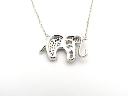 18K gold diamond elephant necklace.